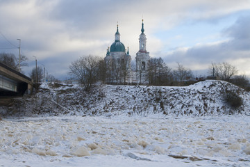Baroque Orthodox Russian church on the bank of the frozen river.