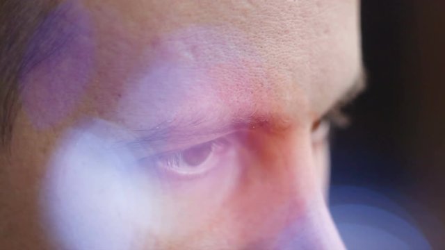 a young man with brown eyes looking to the side ,a computer effect.