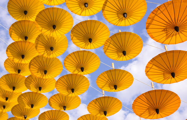 Fototapeta na wymiar many decoration with hanging yellow umbrella outdoor