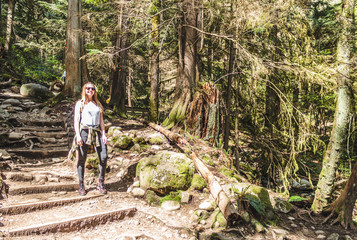 Fototapeta premium Girl at Baden Powell Trail near Quarry Rock at North Vancouver, BC, Canada