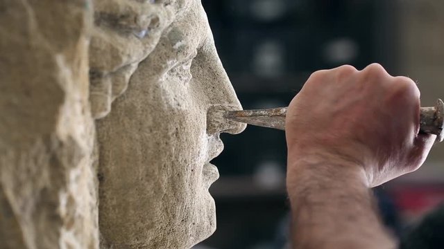 Sculptor is working on the creation of a monument
