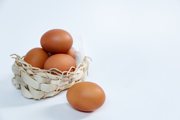 Eggs in a lovely bascket on a white background