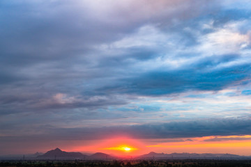 Sunset on mountain at most cloudy sky