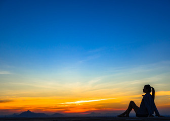 Fototapeta na wymiar woman with sunset silhouette