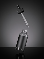 Black blank bottle with a pipette. 3d rendering