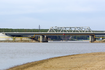 Obraz premium View from river on bridge and the Federal highway M-52. The river Berd, Berdsk, Novosibirsk oblast Siberia, Russia