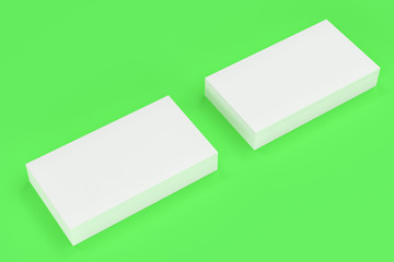 White blank business cards mock-up on green background