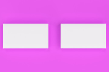 Obraz premium White blank business cards mock-up on violet background