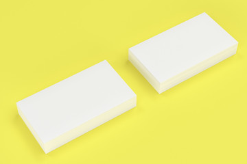 White blank business cards mock-up on yellow background