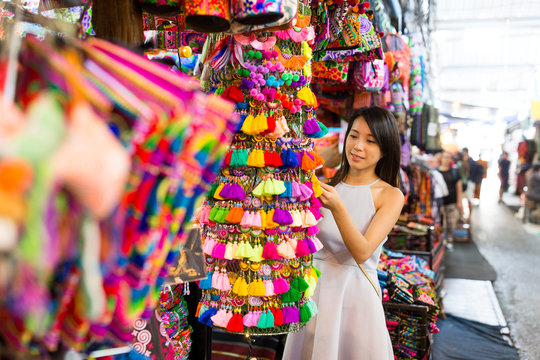 Woman enjoy shopping in weekend market