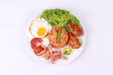 American fried rice topped sunny up,sausage.chicken and herbs