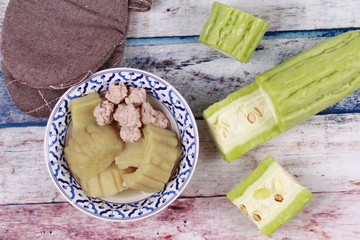 Chinese bitter gourd with meat ball in soup .