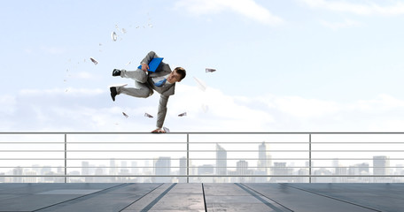 Young businessman breakdancer. Mixed media