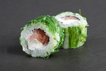 rolls with tuna in green seawed with nut sauce