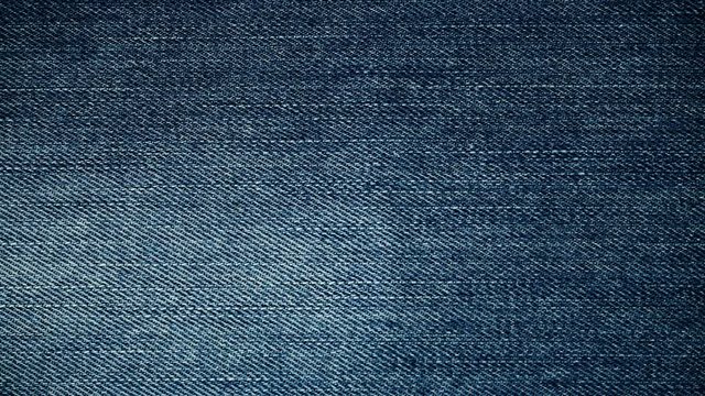 closeup detail of blue denim jeans, texture background 4K ProRes HQ codec