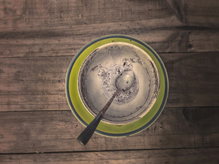 Empty coffee cup on wooden background