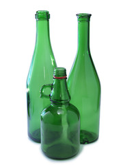 Green bottle of water and alcohol on white background 