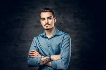 A man with tattooed arm.