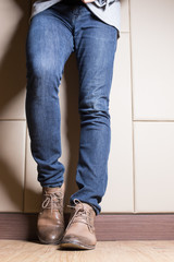 Young  fashion man with jeans and boot in businness concept