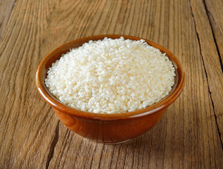Fototapeta na wymiar Japanese rice on wooden background