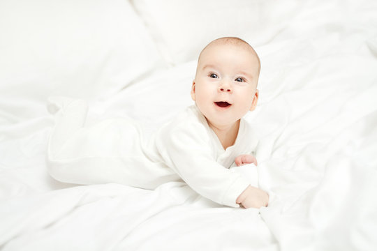 Baby Crawling, New Born Kid in White Bodysuit, Happy Little Child looking up
