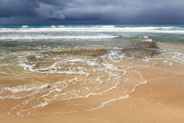 Rocky beach and coming storm