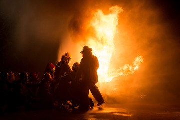 firefighters in teamwork operation
