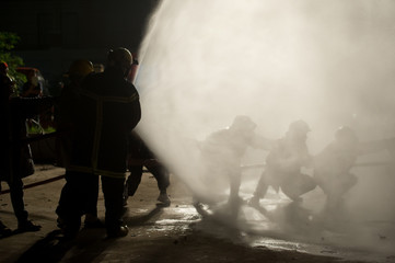 firefighters in teamwork operation