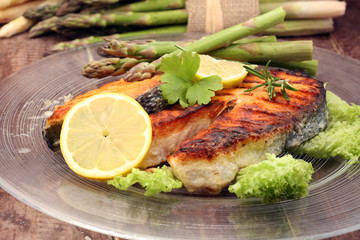 Grilled salmon and asparagus on plate