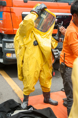 firefighter with hazmat (hazardous material) suits to protect them from danger chemical work on the accident road