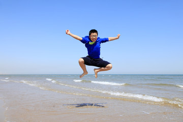 Fototapeta premium A boy playing on the beach
