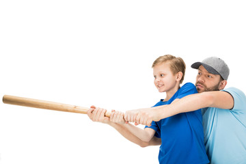 Happy father teaching his son how to play baseball isolated on white