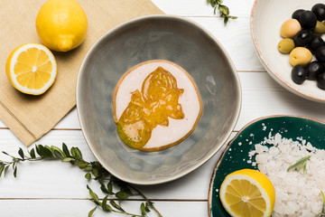 Close-up view of ingredients for homemade cosmetics on wooden table top