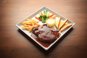 Pork chops with Black Thai Chili Sauce wooden background