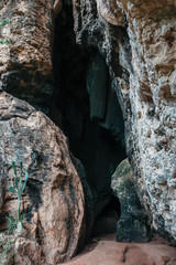 Entrance to a stone cave in a tropical country, Indonesia