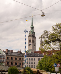 Fototapeta na wymiar View of Munich's Maypole and St.Peter's church with the Town Hall in the background