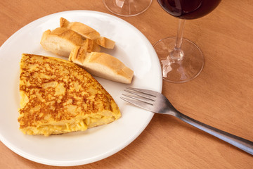 Spanish tortilla with wine, tapas in Madrid bar