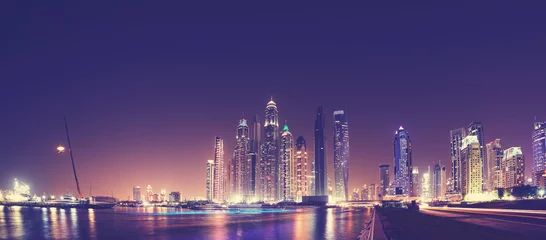 Zelfklevend Fotobehang Fisheye lens panoramic picture of Dubai waterfront skyline at night, color toning applied, United Arab Emirates. © MaciejBledowski