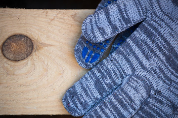 Fototapeta na wymiar Working gloves on Industrial wood