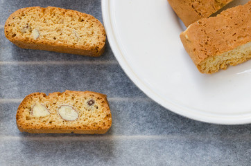 Close up of  fresh baked biscotti cantuccini or cantucci, Italian almond sweets biscuits (cookies) traditionally served with a drink, coffee or vine. Copy space.Top view.