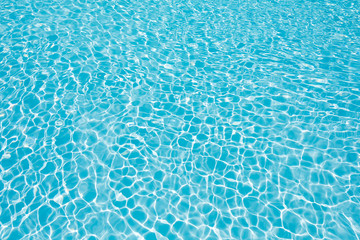 Fototapeta na wymiar Abstract water surface in swimming pool, Beautiful blue water in pool with sun reflection