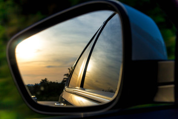 Fototapeta na wymiar car side view mirror on the road