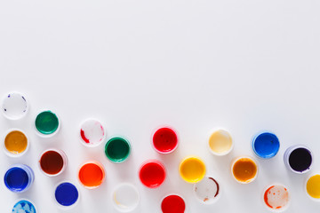 Artist workplace, set of color paints on white