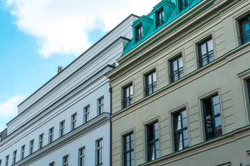white and yellow facaded apartment buildings
