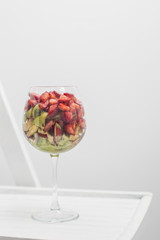 Set of different pieces fresh fruits in glass