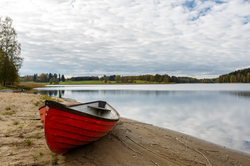 Red boat on the lake shore, Finland