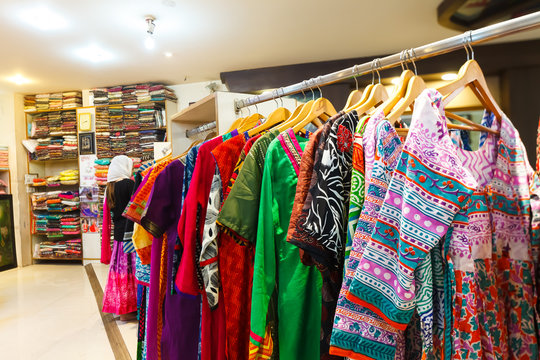 Bright colorful women's clothing in the Indian store Gangotri, Vrindavan.