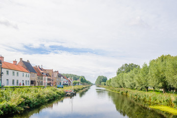 Fototapeta na wymiar Polder landscape with canal by Dame in Belgium