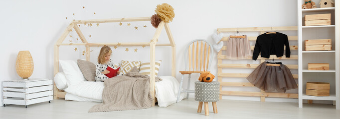 Girl reading in her room