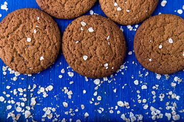 Oatmeal cookies on blue backround. Top view.  Copy space.